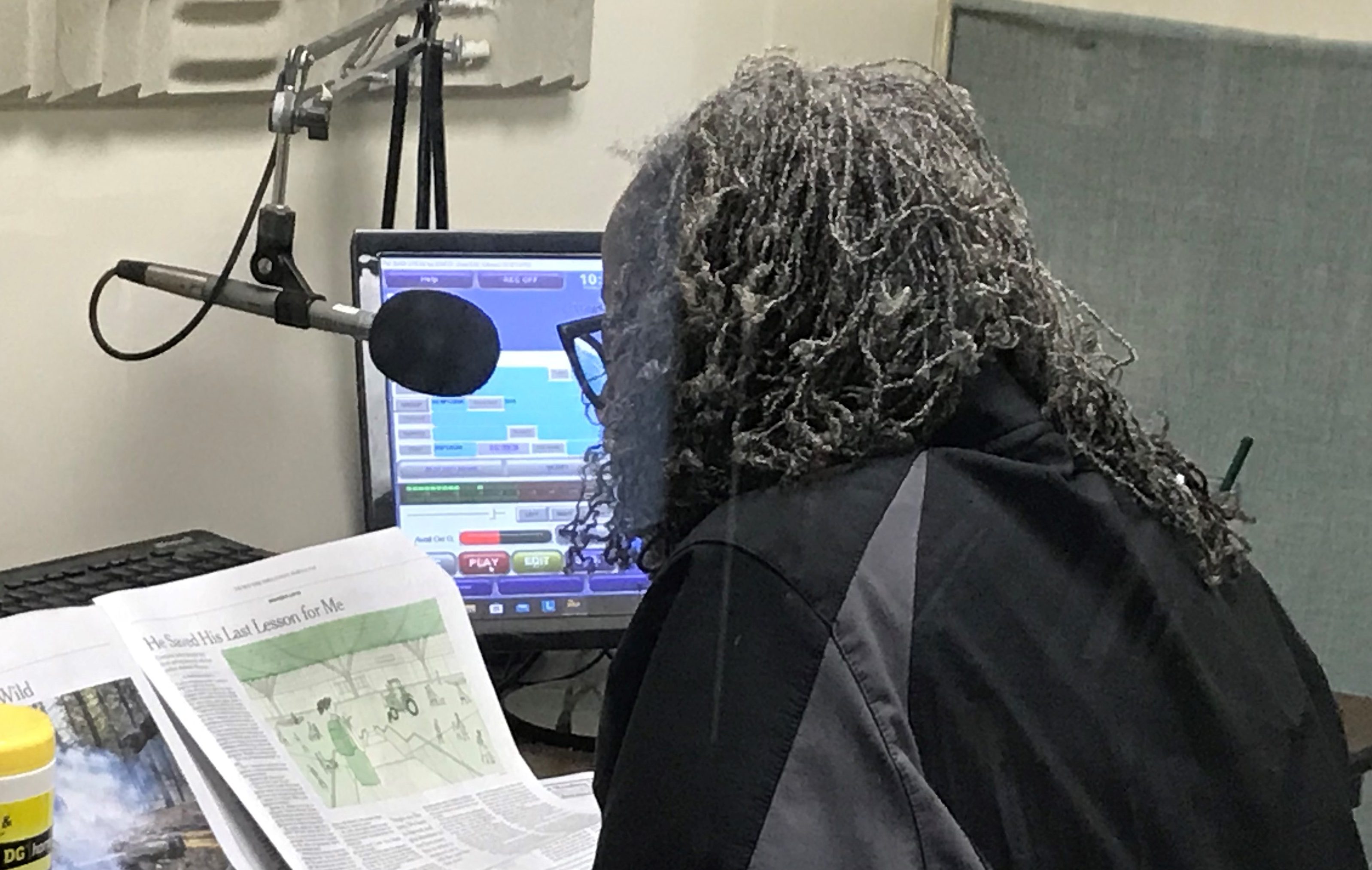 Photo shows a reader recording the NY Times