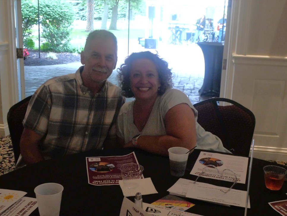 NFRS Board Member Frauke Stoffel and her husband smiling at their table